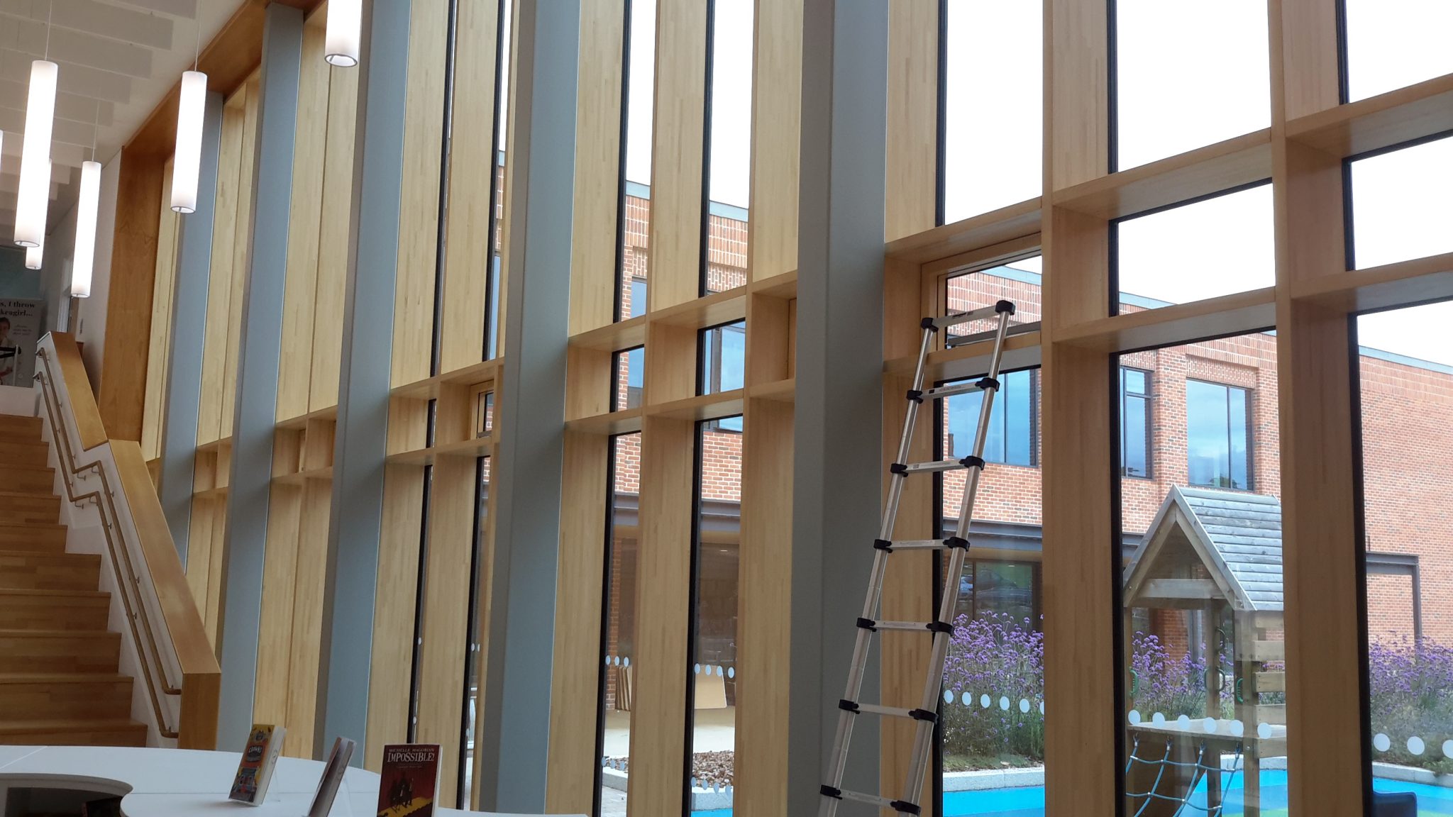 Hybrid composite curtain walling installed in school building