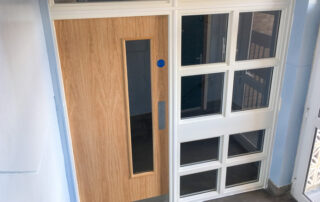 Fitted FD30 rated oak veneered glazed do