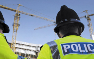 Police observing construction site